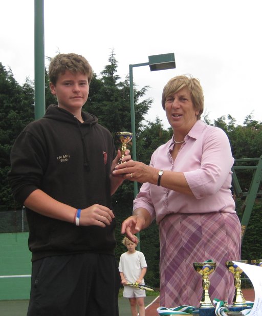 Andrew Cooper receiving trophy