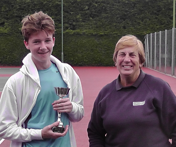 Tom Buckle receiving his winners trophy from Julia Freeman.